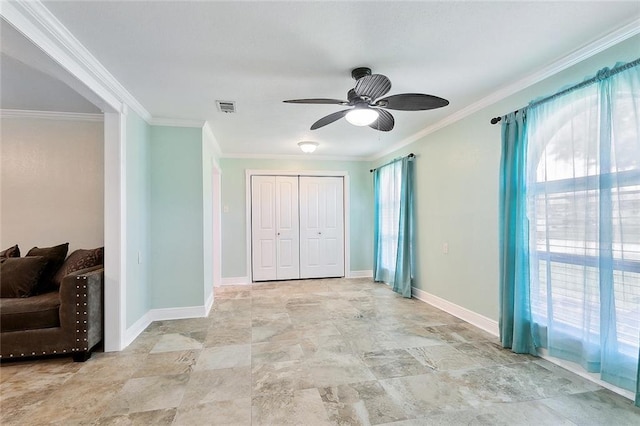 335 Devon Rd, La Place, LA 70068 - unfurnished bedroom featuring crown molding, a closet, baseboards, and stone finish flooring