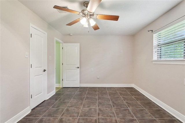 335 Devon Rd, La Place, LA 70068 - spare room with a ceiling fan, baseboards, and tile patterned floors
