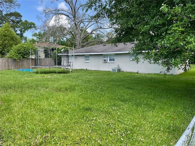 1127 Cousin St, Slidell, LA 70458 - view of yard featuring a trampoline and cooling unit