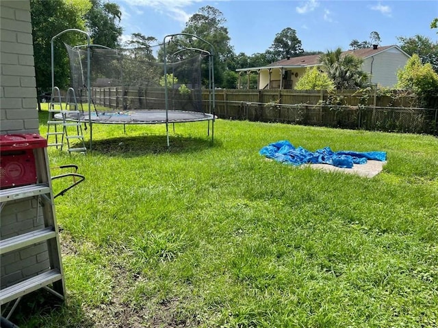 1127 Cousin St, Slidell, LA 70458 - view of yard featuring a trampoline