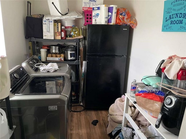 1127 Cousin St, Slidell, LA 70458 - laundry area with washing machine and clothes dryer and wood finished floors