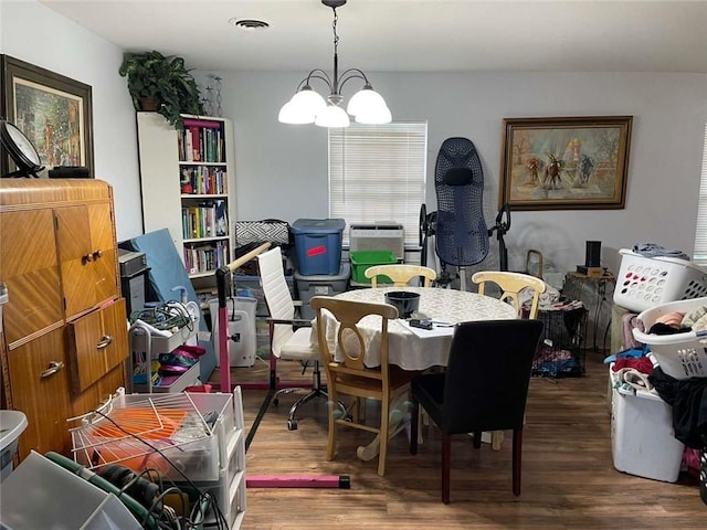 1127 Cousin St, Slidell, LA 70458 - dining area with wood finished floors and a chandelier