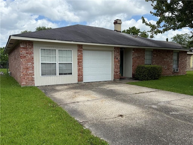 106 Leonell Cir, Slidell, LA 70458 - single story home with a front lawn, an attached garage, a chimney, and brick siding