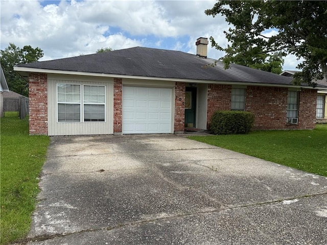 106 Leonell Cir, Slidell, LA 70458 - ranch-style home featuring a front yard, a chimney, an attached garage, driveway, and brick siding