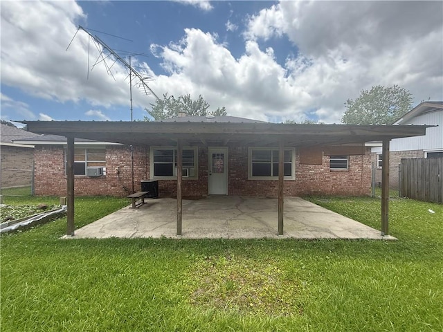 106 Leonell Cir, Slidell, LA 70458 - back of house featuring brick siding, a patio area, and central AC