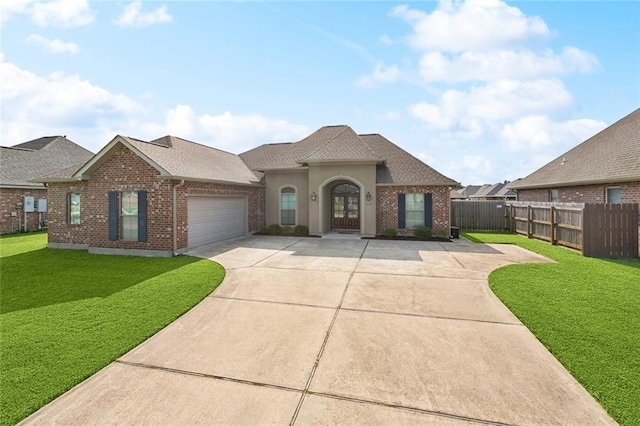 410 Lakewood Dr, Luling, LA 70070 - view of front facade with an attached garage, driveway, brick siding, and a shingled roof