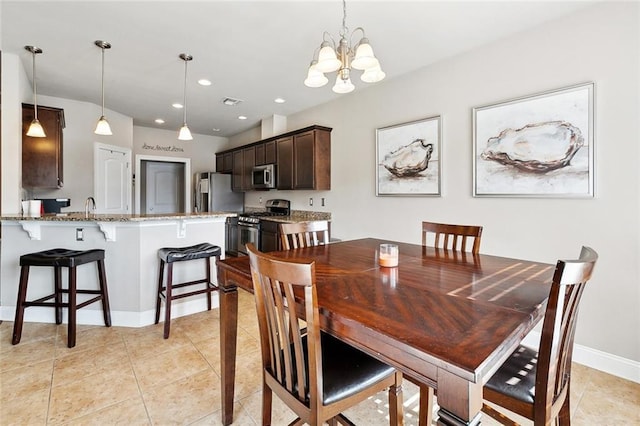410 Lakewood Dr, Luling, LA 70070 - dining area featuring a chandelier, light tile patterned floors, baseboards, and recessed lighting
