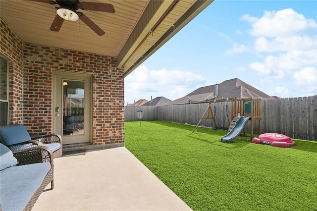 410 Lakewood Dr, Luling, LA 70070 - view of yard featuring a ceiling fan, a playground, and a patio area