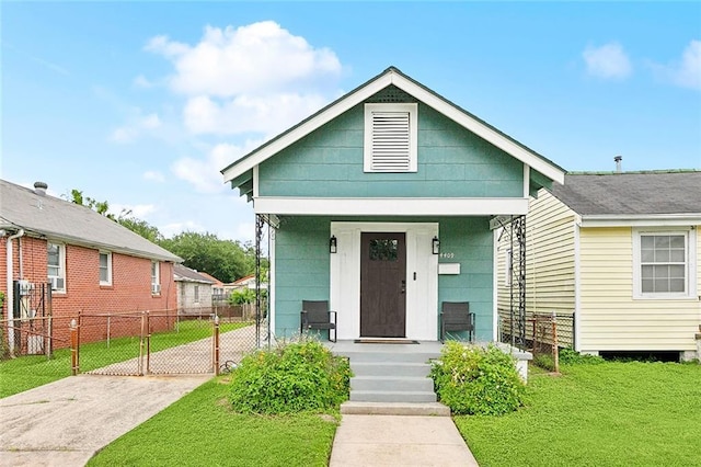 4409 Annette St, New Orleans, LA 70122 - shotgun-style home featuring a porch