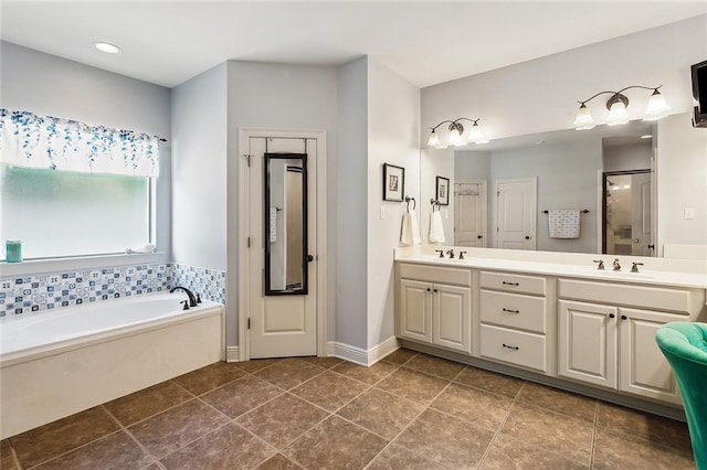229 Pine Crest Dr, Madisonville, LA 70447 - full bath with double vanity, a garden tub, and a stall shower