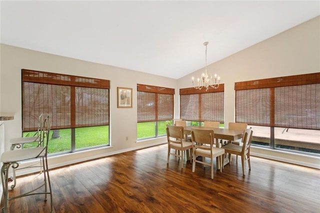 71152 Cutter Pl, Abita Springs, LA 70420 - dining space featuring a chandelier, vaulted ceiling, healthy amount of natural light, wood finished floors, and baseboards