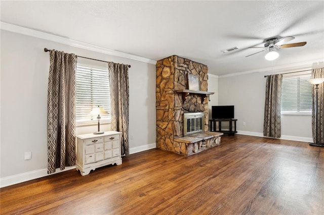 71152 Cutter Pl, Abita Springs, LA 70420 - living room with a ceiling fan, a fireplace, wood finished floors, ornamental molding, and baseboards
