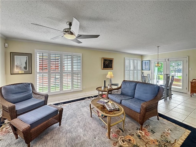 177 Moonraker Dr, Slidell, LA 70458 - tiled living room with ceiling fan and a textured ceiling