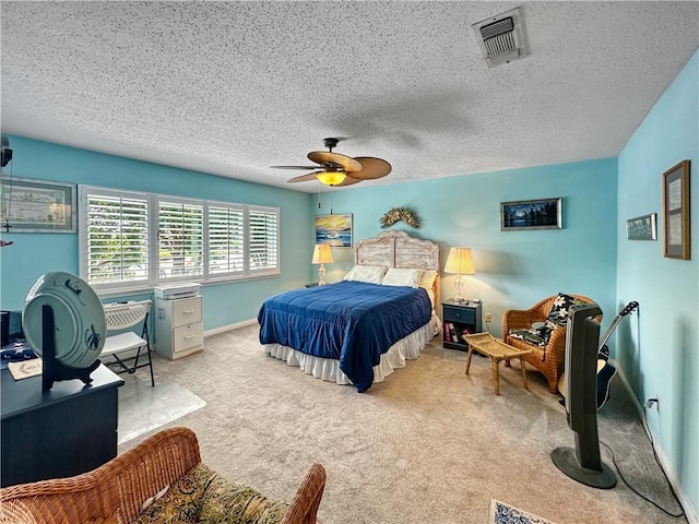 177 Moonraker Dr, Slidell, LA 70458 - carpeted bedroom featuring a textured ceiling, a ceiling fan, and baseboards