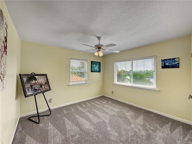 177 Moonraker Dr, Slidell, LA 70458 - spare room featuring healthy amount of natural light, carpet flooring, a textured ceiling, ceiling fan, and baseboards