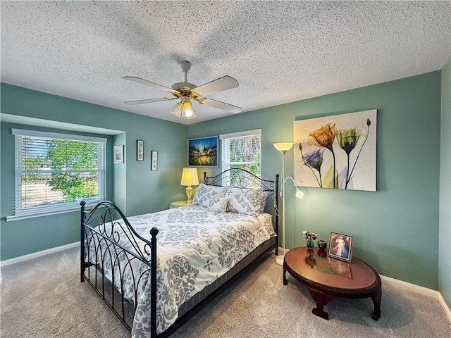 177 Moonraker Dr, Slidell, LA 70458 - carpeted bedroom with baseboards, ceiling fan, and a textured ceiling