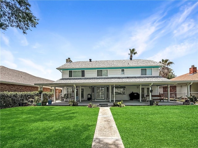 177 Moonraker Dr, Slidell, LA 70458 - rear view of house with a yard, a chimney, and a porch