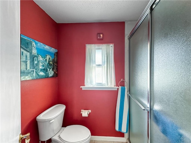 177 Moonraker Dr, Slidell, LA 70458 - full bathroom with toilet, a stall shower, and a textured ceiling