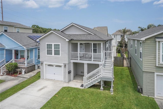 227 20th St, New Orleans, LA 70124 - view of front of property featuring covered porch, stairway, concrete driveway, and a garage
