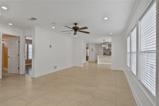 227 20th St, New Orleans, LA 70124 - spare room with recessed lighting, baseboards, ceiling fan, crown molding, and a chandelier