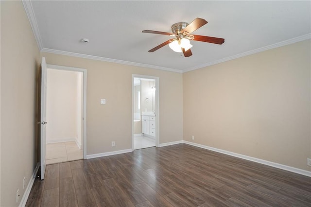 227 20th St, New Orleans, LA 70124 - unfurnished bedroom with dark wood-type flooring, ornamental molding, baseboards, a ceiling fan, and connected bathroom