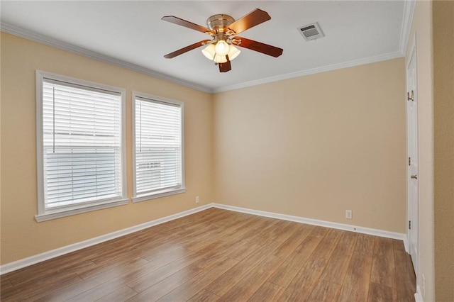 227 20th St, New Orleans, LA 70124 - spare room with wood finished floors, ornamental molding, a ceiling fan, and baseboards