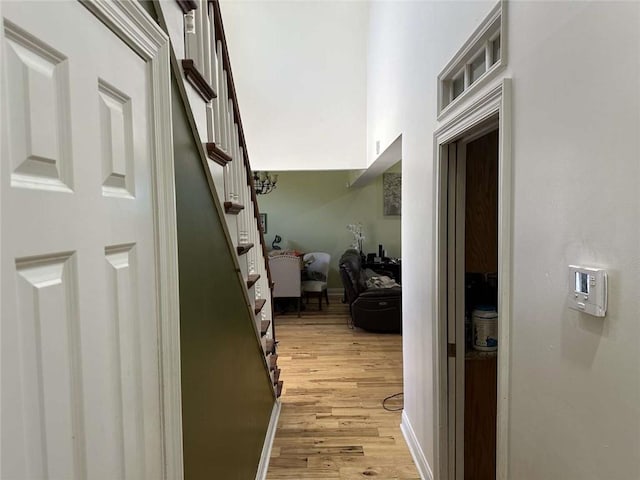 108 Riverbirch Dr, Lafayette, LA 70508 - hallway with light wood-type flooring, stairway, and baseboards