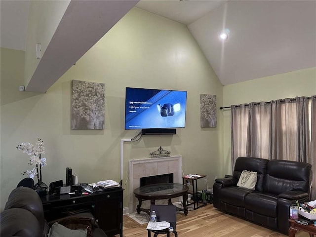 108 Riverbirch Dr, Lafayette, LA 70508 - living room with light wood-style floors, vaulted ceiling, and a tiled fireplace