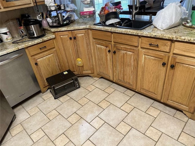 108 Riverbirch Dr, Lafayette, LA 70508 - kitchen featuring dishwasher, a sink, brown cabinets, and light stone counters
