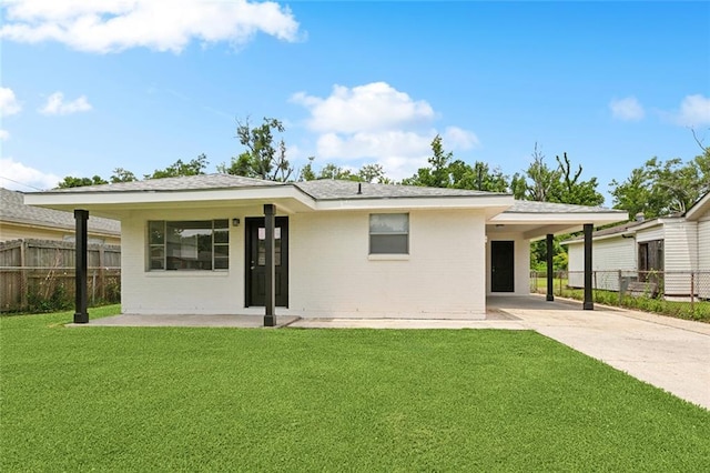 636 Oak Ave, Bridge City, LA 70094 - rear view of property with driveway, an attached carport, and brick siding