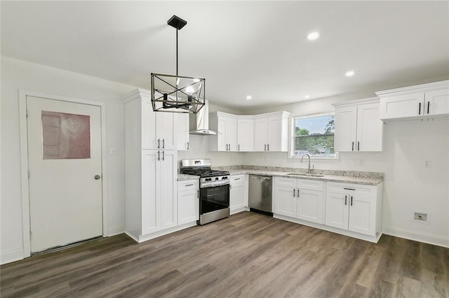 636 Oak Ave, Bridge City, LA 70094 - kitchen featuring stainless steel appliances, a sink, a chandelier, dark wood finished floors, and white cabinets