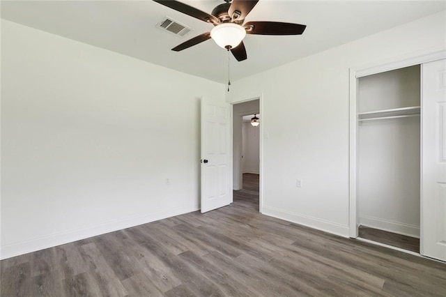 636 Oak Ave, Bridge City, LA 70094 - unfurnished bedroom featuring wood finished floors, a closet, baseboards, and a ceiling fan