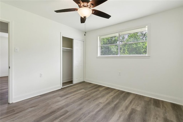 636 Oak Ave, Bridge City, LA 70094 - unfurnished bedroom featuring wood finished floors, a closet, baseboards, and a ceiling fan