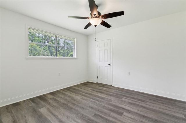 636 Oak Ave, Bridge City, LA 70094 - spare room featuring ceiling fan, dark wood-style floors, and baseboards