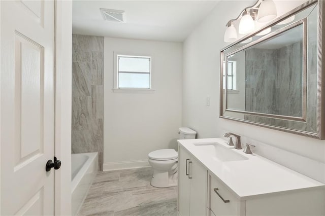 636 Oak Ave, Bridge City, LA 70094 - bathroom with toilet, vanity, baseboards, and marble finish flooring