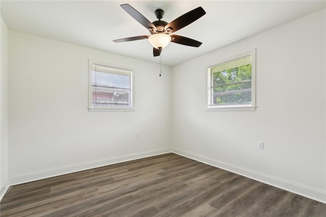 636 Oak Ave, Bridge City, LA 70094 - spare room featuring dark wood-style flooring, baseboards, and ceiling fan