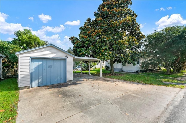 501 Gaudet Dr, Marrero, LA 70072 - garage featuring a carport and driveway