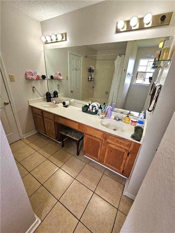2724 Marisha Ct, Marrero, LA 70072 - full bath with tile patterned flooring, double vanity, a textured ceiling, and a shower with shower curtain