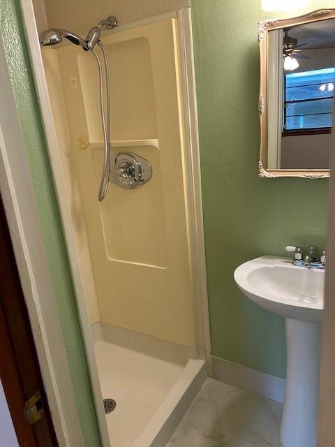 523 Beverly Garden Dr, Metairie, LA 70001 - bathroom featuring a shower stall and baseboards
