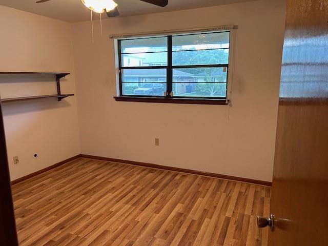 523 Beverly Garden Dr, Metairie, LA 70001 - unfurnished room featuring ceiling fan, wood finished floors, and baseboards