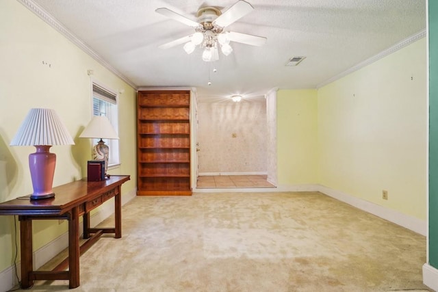 1400 Velma St, Metairie, LA 70001 - empty room with carpet floors, ornamental molding, a ceiling fan, baseboards, and a textured ceiling