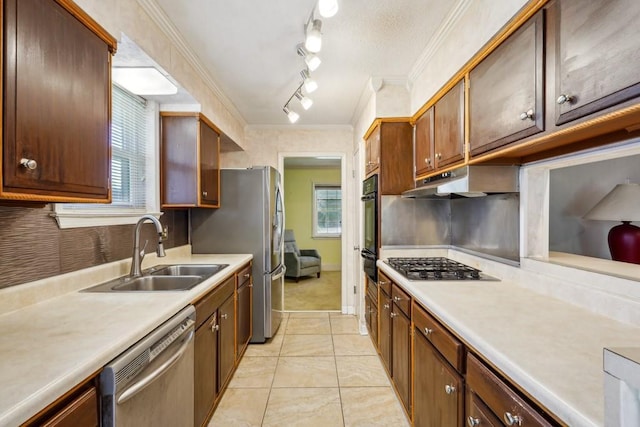1400 Velma St, Metairie, LA 70001 - kitchen featuring appliances with stainless steel finishes, a sink, light countertops, under cabinet range hood, and light tile patterned floors