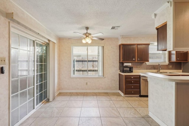 1400 Velma St, Metairie, LA 70001 - kitchen featuring a sink, light countertops, ceiling fan, a textured ceiling, and black microwave