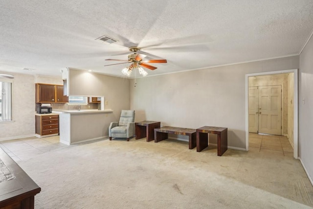 1400 Velma St, Metairie, LA 70001 - living room featuring a ceiling fan, baseboards, a textured ceiling, light colored carpet, and ornamental molding