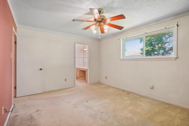 1400 Velma St, Metairie, LA 70001 - unfurnished bedroom with carpet, a textured ceiling, ornamental molding, ensuite bath, and baseboards