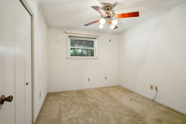 1400 Velma St, Metairie, LA 70001 - empty room featuring ornamental molding, light carpet, a ceiling fan, baseboards, and a textured ceiling