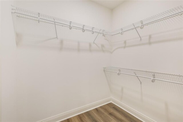 2308 Crossing Ct, Mandeville, LA 70448 - spacious closet with dark wood-type flooring