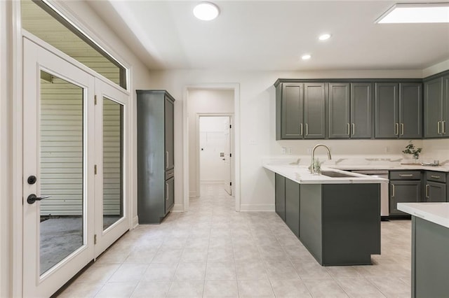 2308 Crossing Ct, Mandeville, LA 70448 - kitchen with a peninsula, light countertops, recessed lighting, a sink, and stainless steel dishwasher