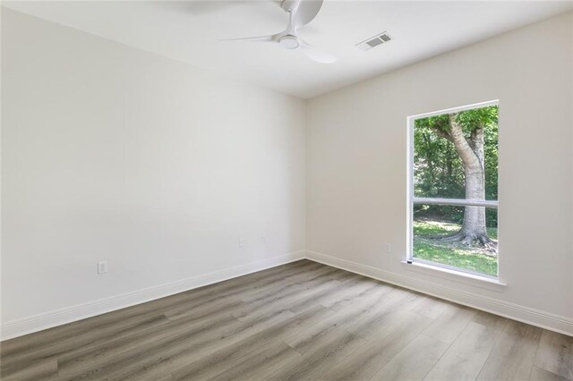 2308 Crossing Ct, Mandeville, LA 70448 - unfurnished room featuring wood finished floors, a ceiling fan, and baseboards