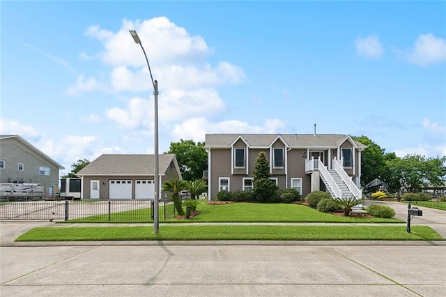 4321 San Remo Rd, New Orleans, LA 70129 - view of front facade with concrete driveway and an outbuilding